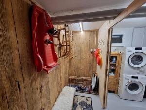 a small room with a red car on the wall at by Interhome in Sattel +15 photos