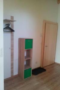 an empty room with a book shelf and a door at Apartment S'Ottä by Interhome in Sattel