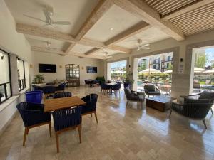 a living room with chairs and tables and windows at LUMINARIA Pool, Near the Historic Center | Elegant in San Miguel de Allende