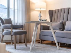 a living room with a table and two chairs at Holiday Home Verena's B&B by Interhome in Sachseln
