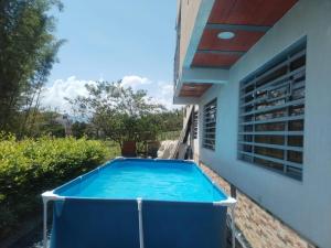 a swimming pool in the backyard of a house at Hospedaje Villa Laura in Cite +13 photos