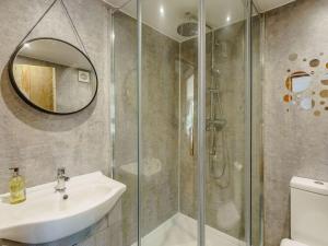a bathroom with a shower and a sink and a mirror at 6 Bed in Rye- oc-89037 in Camber +25 photos