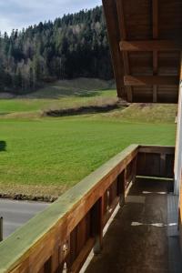 a porch with a view of a field of grass at Apartment Karotte by Interhome in Trub