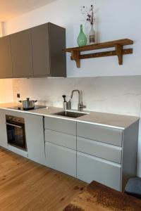 a kitchen with a sink and a counter top at Apartment Poste viglia by Interhome in Lohn