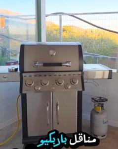 a grill sitting in a kitchen with a window at New view in Majdal Shams