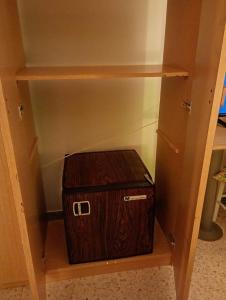 a suitcase is sitting inside of a closet at L'Ancora in Bisceglie