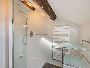 a small bathroom with a shower and a sink at 3 Bed in Keswick oc-94346 in Threlkeld +17 photos