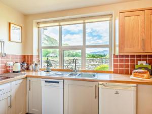a kitchen with a sink and a window at 3 Bed in Keswick oc-sz148 in Grange +17 photos