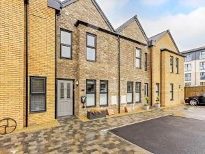 an empty parking lot in front of a brick building at 2 Bed in Sandown oc-89291 in Sandown