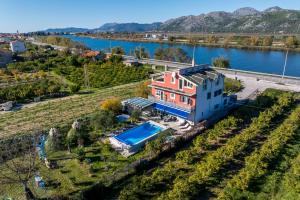 an aerial view of a house with a swimming pool at Holiday house Goran, Opuzen in Opuzen