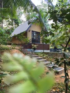 a small house in the middle of a forest at Sansun Villa in Harumalgoda West