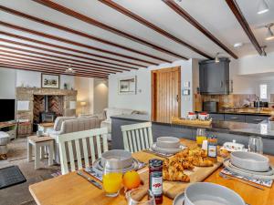 a kitchen and living room with a table with food at 3 Bed in Richmond oc-75649 in Muker