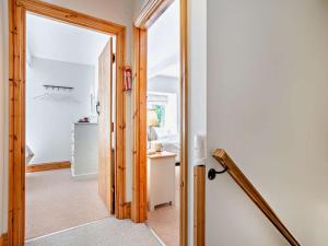 a hallway with a door leading into a room at 3 Bed in Richmond oc-75649 in Muker +21 photos