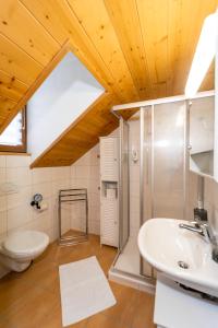 a bathroom with a toilet and a sink at Café des Voyageurs Noës in Chalais