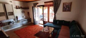 a living room with a couch and a coffee table at Vikendica Popovic in Doboj