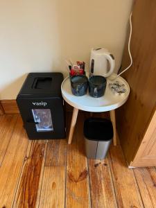a small table with two bowls on it next to a toaster at Ríocht Fódla 3 in Killarney
