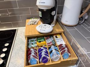 a kitchen counter with a tray of food and a coffee maker at restaway at Hamilton in Doncaster +18 photos