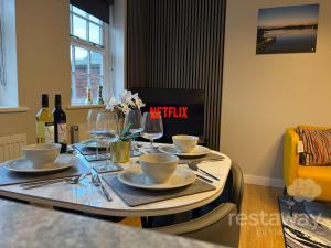 a table with plates and wine glasses on it at restaway at Hamilton in Doncaster