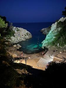 a view of a beach with people in the water at Solemar Salento in Marittima