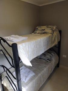 two bunk beds in a room with towels on them at Complejo Los Olivos in Ciudad Lujan de Cuyo +26 photos