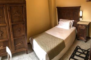 Postel nebo postele na pokoji v ubytování Albergo La Pace