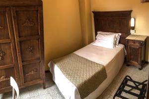 En eller flere senge i et værelse på Albergo La Pace