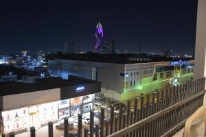 a view of a city at night with a building at MyFlower 3 Hotel in Erbil