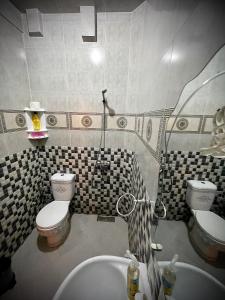 a bathroom with a toilet and a sink at Tayri Surf House Aourir in Agadir +45 photos