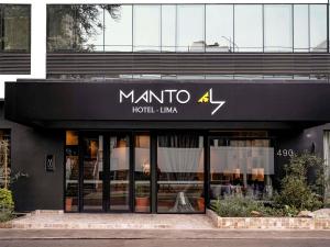 a store with a sign on the front of a building at Manto Hotel Lima - MGallery Collection in Lima