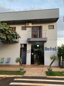 a hotel with a sign on the side of a building at Hotel Barichello in São Miguel das Missões