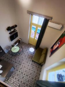 a small living room with a table and a window at Apartment Studio 7 in Mytilene +38 photos