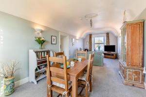 a dining room and living room with a table and chairs at 1 Bed in Queen Camel oc-c30506 in Queen Camel +7 photos