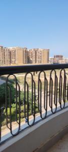 a balcony with a view of a city at A ROOM in mandara in Alexandria +10 photos
