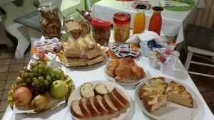 a table with many plates of food on it at B&B La Lanterna in Fermo