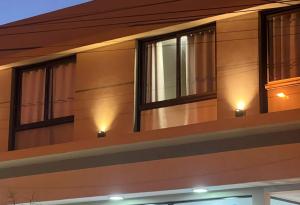 a couple of windows on the side of a house at Olmos Suites in Mina Clavero +2 photos