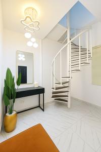 a living room with a staircase and a mirror at Gift cozy 1 bedroom in Lekki