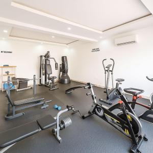 a gym with cardio equipment in a room at Gift cozy 1 bedroom in Lekki