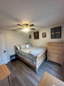 a bedroom with a bed and a ceiling fan at A&D Homes Peaceful Retreat in Jacksonville