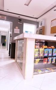 a display case in a store with food at hotel chanel in Itagüí