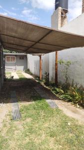 a patio with awning on the side of a house at Las Tres Reinas A in Colorado River