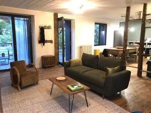 a living room with a couch and a table at Hilltop Haven in Parlan in Parlan