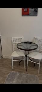 a table and two chairs and a table and chairs at Lupo in Budva