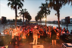 a large crowd of people standing in front of a stage at Hotel El Ganzo - Adults Only in San José del Cabo +100 photos
