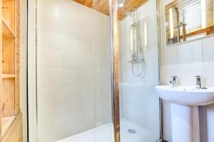 a bathroom with a shower and a sink at 3 Bed in Torquay oc-h75059 in Torquay +13 photos