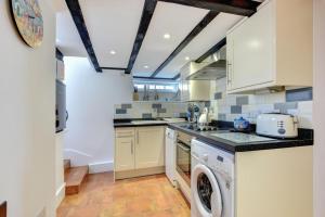 a kitchen with a washer and dryer at 3 Bed in Torquay oc-h75059 in Torquay