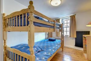 a bedroom with two bunk beds in a room at 3 Bed in Torquay oc-h75059 in Torquay