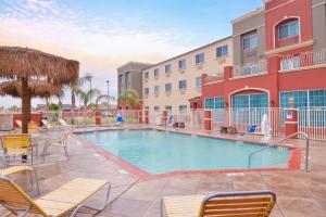 a swimming pool in front of a building at Holiday Inn Express Hotel & Suites El Centro by IHG in El Centro