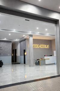 a lobby of a hotel with a sign on a wall at Mina Motel 2 in Thuan An