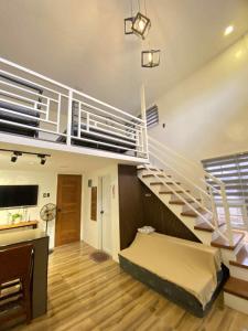 a room with a loft with a bed and stairs at Benido Farm - A Secret Haven in San Jose +77 photos