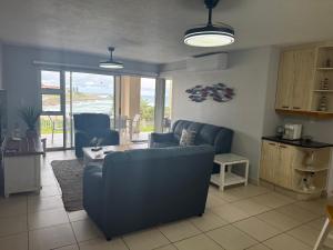 a living room with a couch and a table at 37 Laguna La Crete in Margate